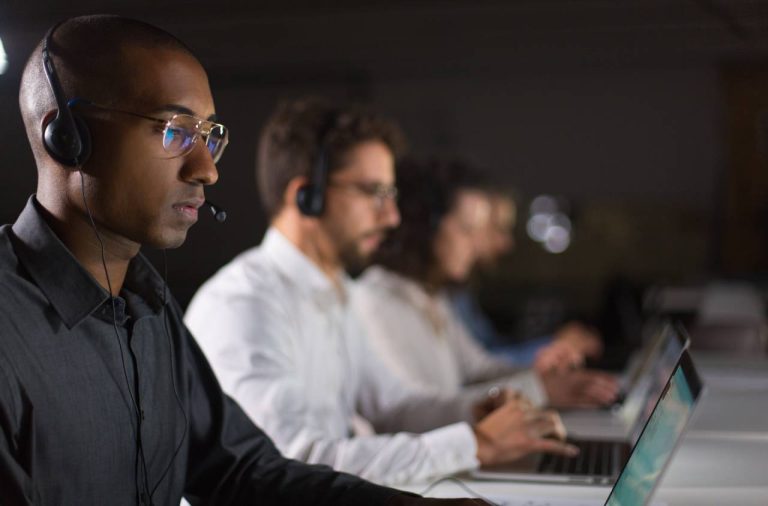 a group of people working on computers